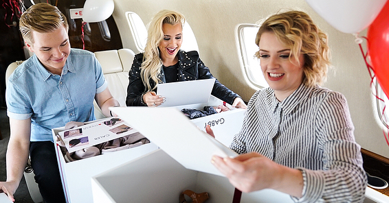 Caleb Lee Hutchinson, Gabby Barrett, and Maddie Poppe opening gift boxes from Macy's on May 15, 2018.
Photo credit: American Idol
